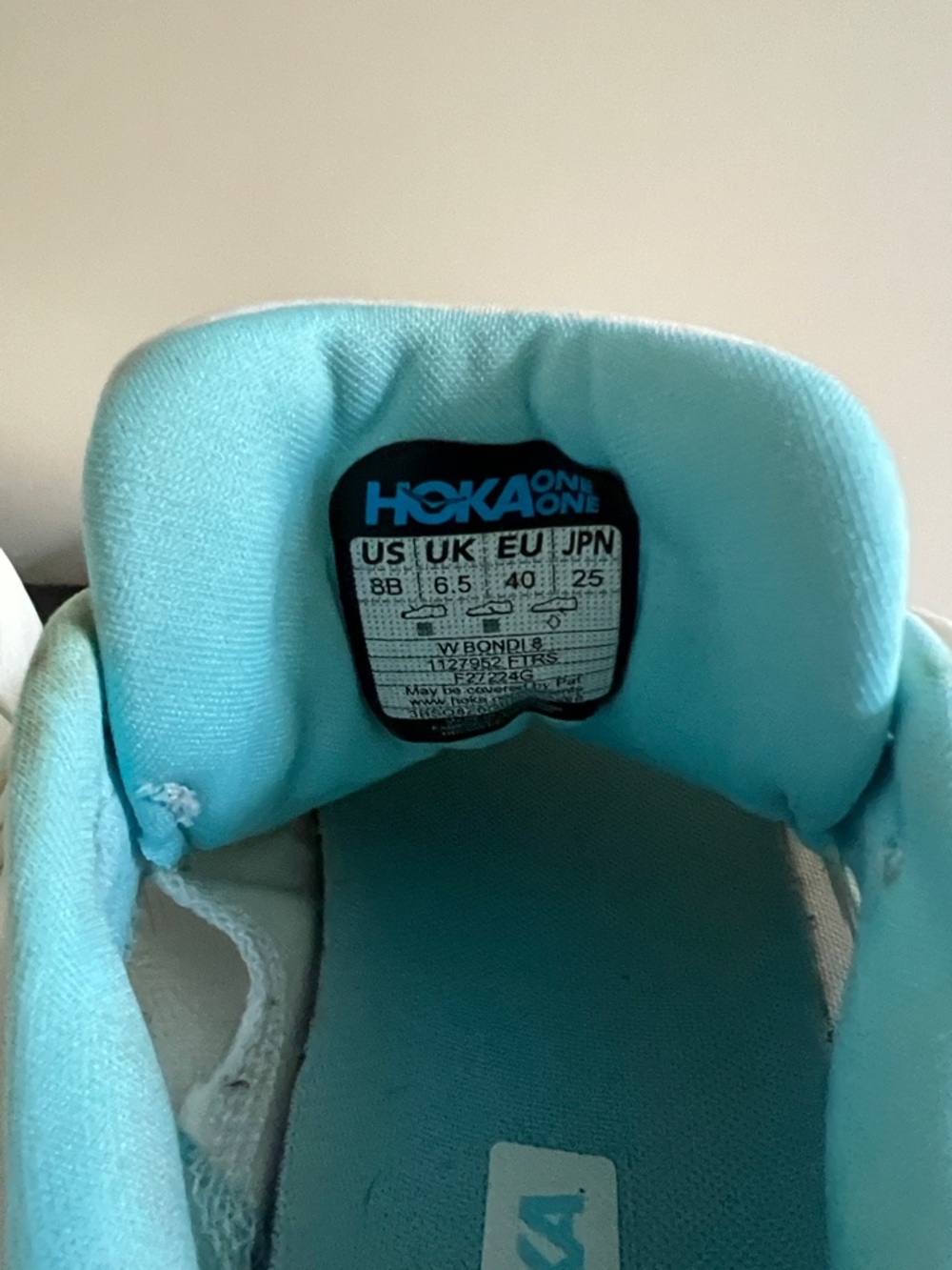 Hoka Bondi 8 in the "Frost / Rose Gold" colorway. - Picture 5 of 5
